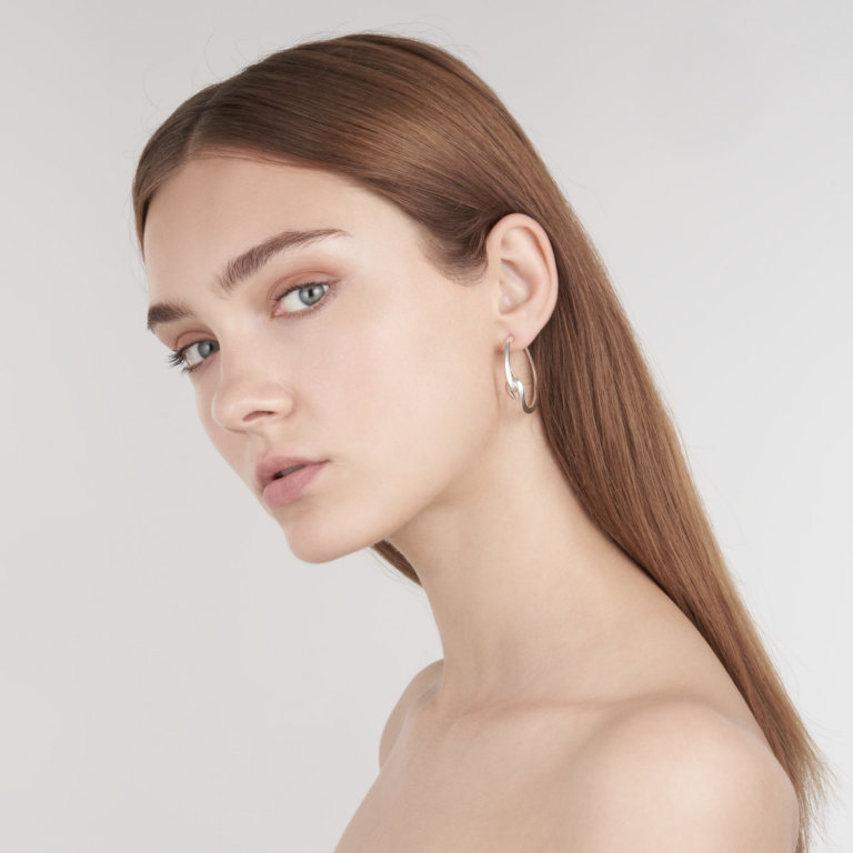 Image of a lady wearing Shaun Leane Silver Earrings