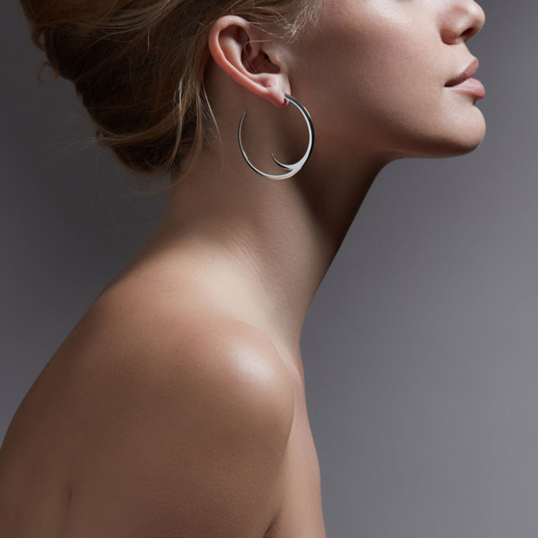 Image of a lady wearing Shaun Leane Silver Talon Cat Claw Large Hoop Earrings