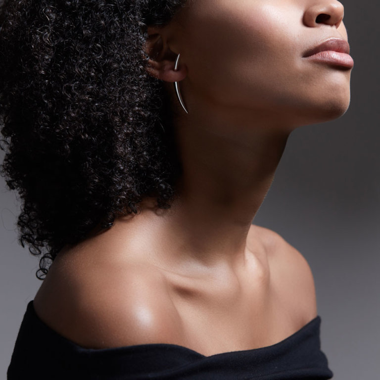 Image of a lady wearing Shaun Leane Silver Quill Earrings