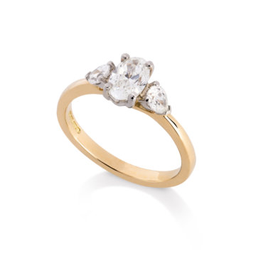Image of an oval and Pear Cut 1.04ct Diamond Three Stone Ring in yellow gold and platinum