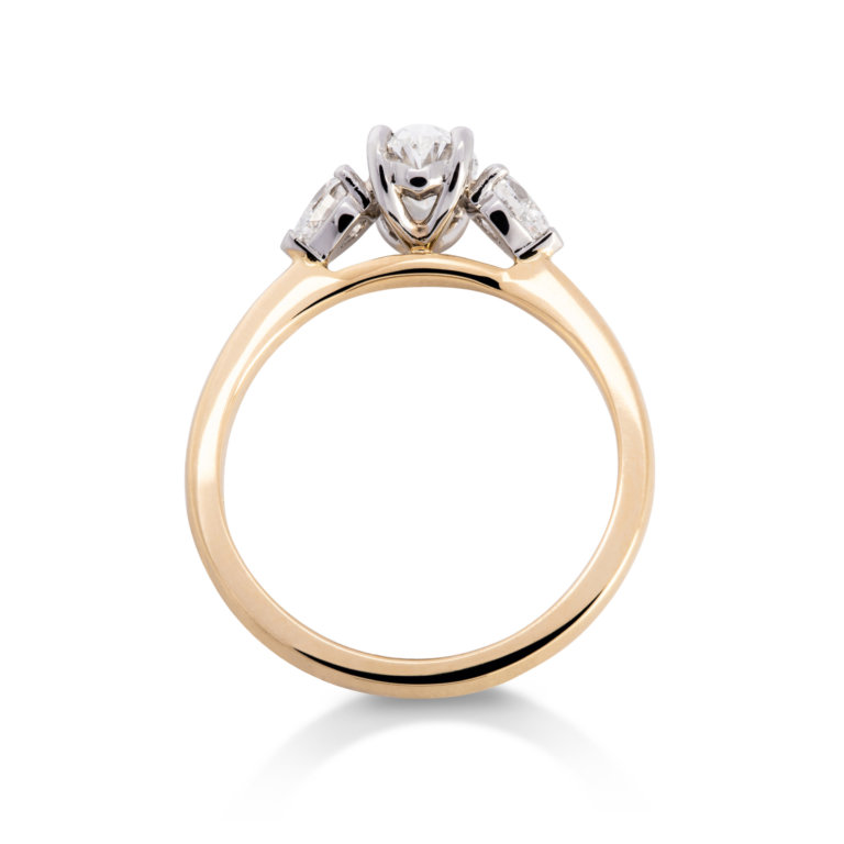 Image of an Oval and Pear Cut 1.04ct Diamond Three Stone Ring in yellow gold and platinum