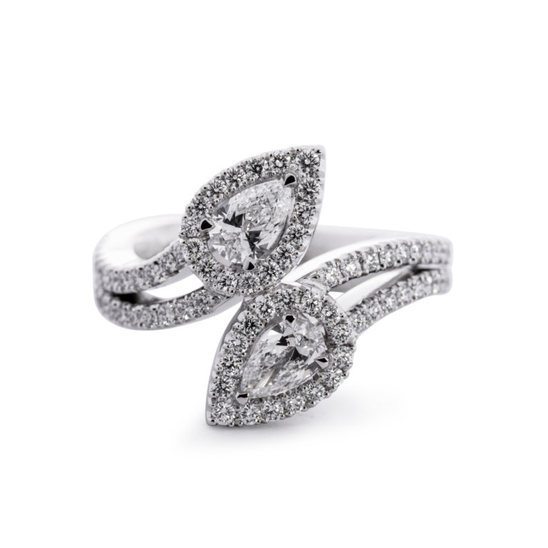 Image of a pear and Brilliant Cut Diamond Halo Crossover Ring in platinum