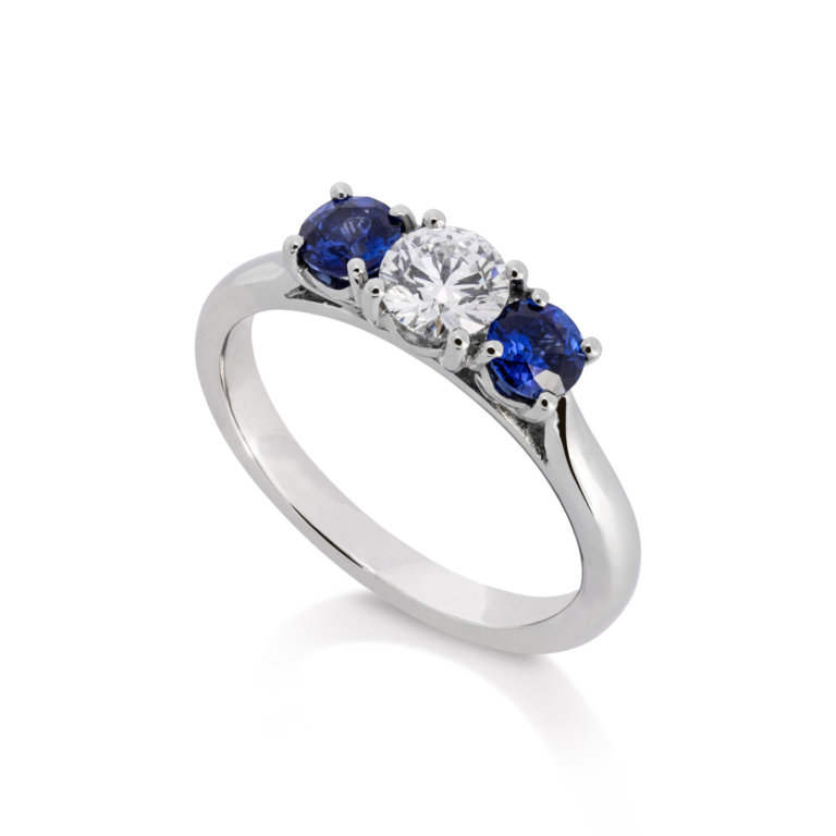 Image of a diamond and Sapphire Three Stone Ring in platinum