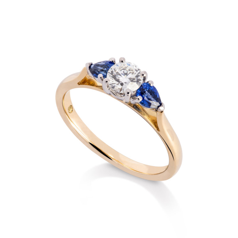 Image of a Diamond and Sapphire Three Stone Ring in yellow and white gold