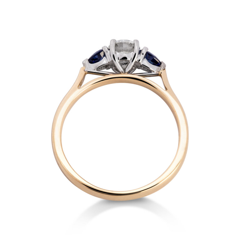 Image of a Diamond and Sapphire Three Stone Ring in yellow and white gold