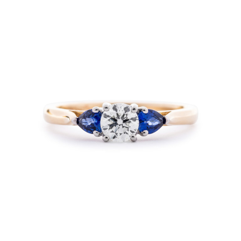 Image of a Diamond and Sapphire Three Stone Ring in yellow and white gold