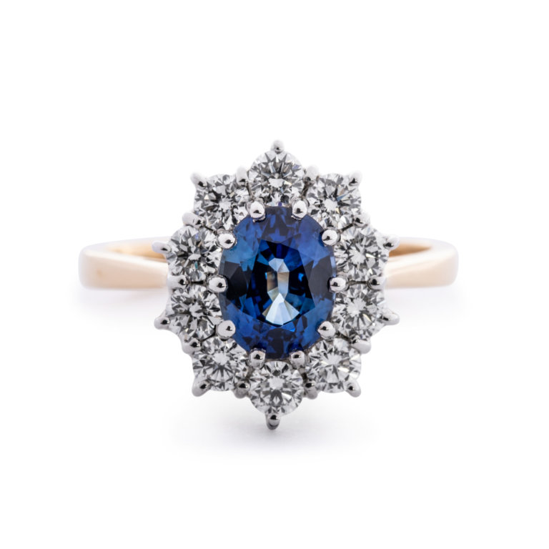 Image of a Sapphire and Diamond Classic Oval Cluster Ring in yellow and white gold