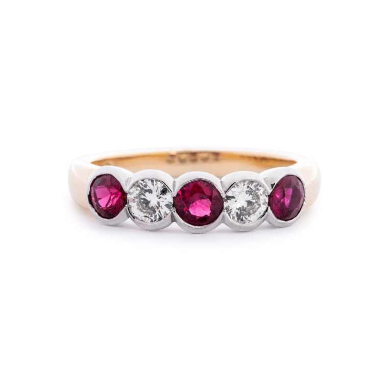 Image of a Ruby and Diamond Rub-Over Five Stone Ring in yellow and white gold
