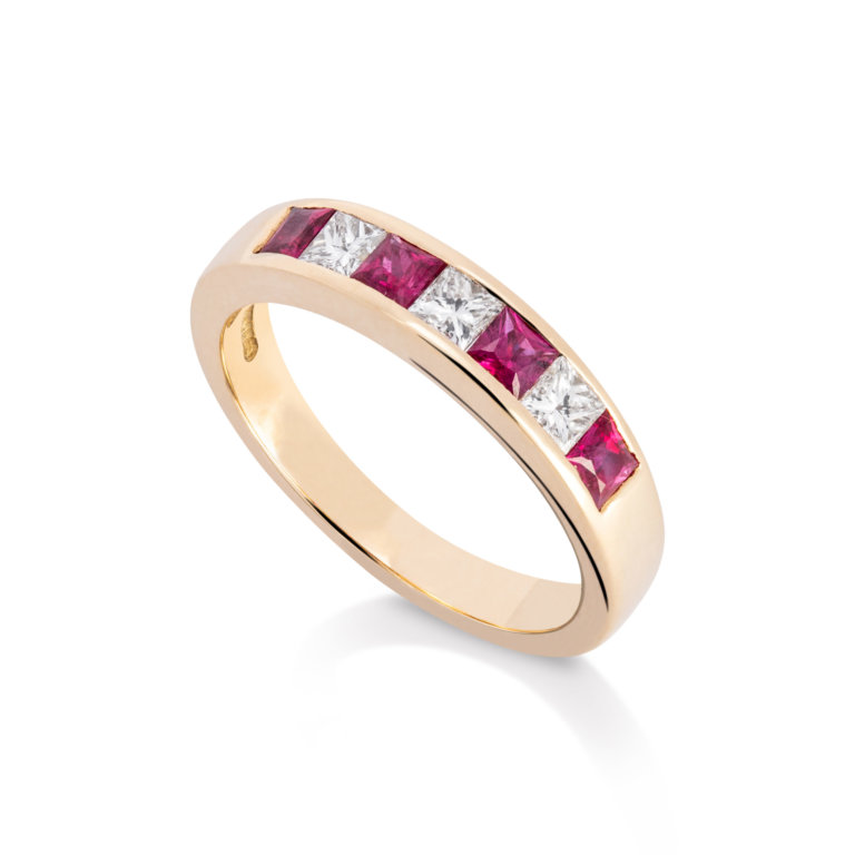 Image of a ruby and Diamond Channel Set Eternity Ring in yellow gold