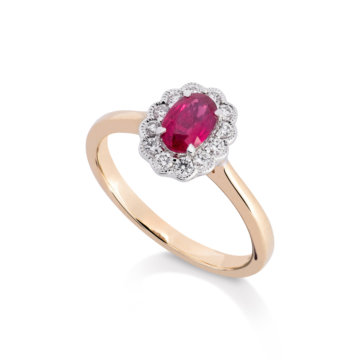 Image of a ruby and Diamond Oval Cluster Ring in yellow gold