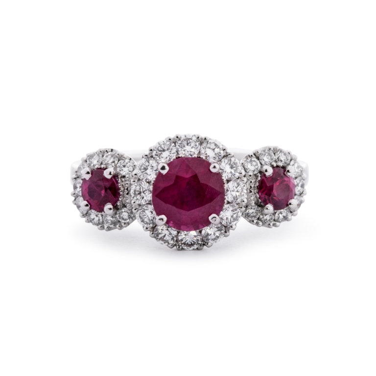 Image of a Ruby and Diamond Triple Halo Ring in platinum gold