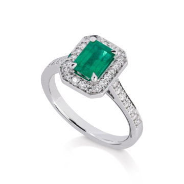 Image of an emerald and Diamond Rectangular Halo Ring set in white gold