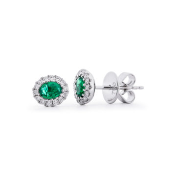 Image of a pair of diamonds and emerald earrings in white gold.