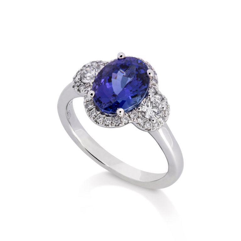 Image of an Oval Tanzanite and Brilliant Cut Diamond Halo Ring