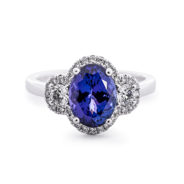 Image of an Oval Tanzanite and Brilliant Cut Diamond Halo Ring