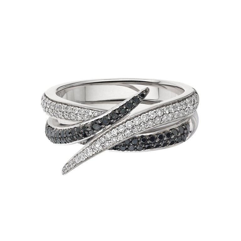 Image of a ring set with white and black stones